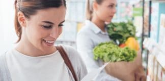 lady at store with clean food list
