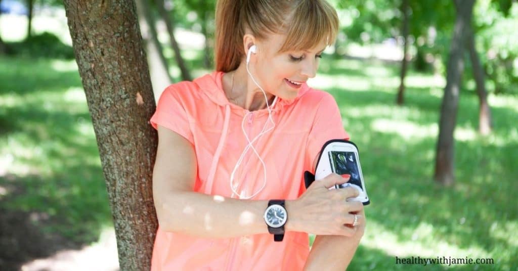 woman walking listening to health podcast